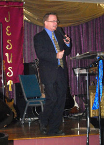Pastor Chuck preaching one year after being in the hospital